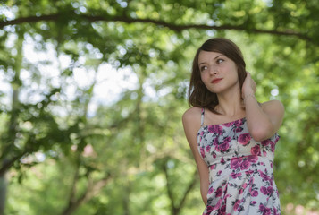 Fototapeta premium Romantic young woman posing outdoor.