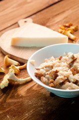 risotto with mushrooms on a wooden background