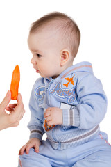 Child looks at the carrot