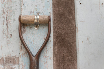harrow garden tool hang on grunge wooden wall