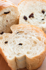 Half loaf of fresh raisin bread.