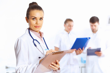 Fototapeta premium Young female doctor in white uniform