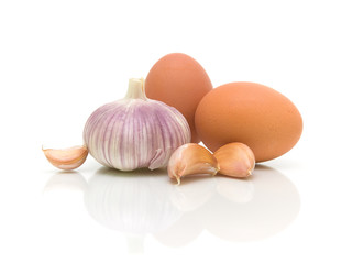 garlic and eggs close-up on white background