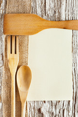 Utensils, sheet of paper and ribbon