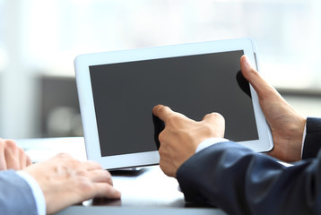 Businessman holding digital tablet