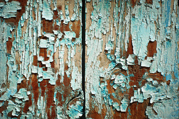 Old cracked paint on wooden wall. Grunge background