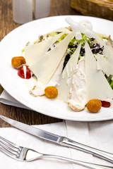 Caesar salad on the table in a restaurant