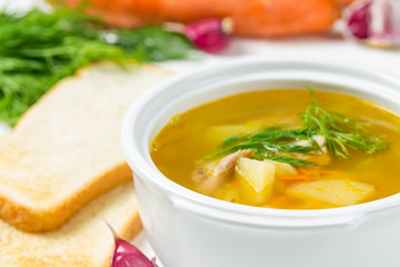 Pea soup in a tureen and bread