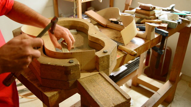 Luthier working in workplace