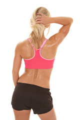 woman pink sports bra wet back