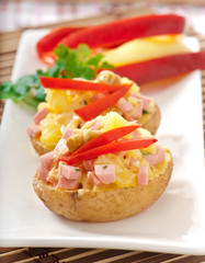 baked potato with sausages and salad