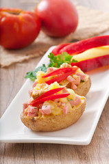 baked potato with sausages and salad