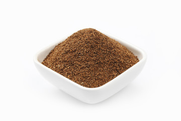 Cinnamon Powder in a square Bowl.