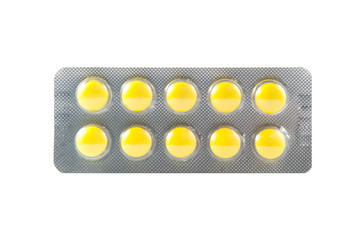 Coated yellow tablet in transparent blister pack