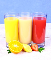 Bananas, strawberry, oranges slice, juice in glass