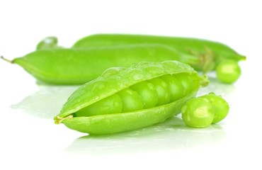 Fresh wet peas in a pod on a white background