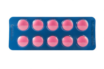 Pink tablet in transparent blister pack