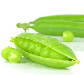 Fresh wet peas in a pod on a white background