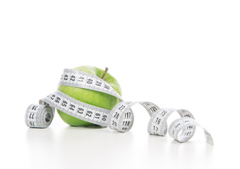 weight loss concept green apple and tape measure