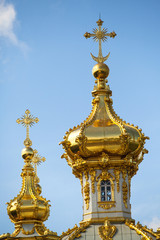 Fototapeta na wymiar Closeup of golden cupola in Summer Gardens - Peterhof, Russia.