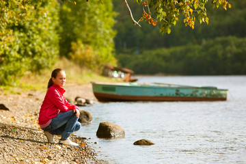 Teen-girl near the river in summer.