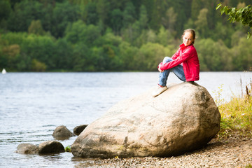 Teen-girl near the river in summer.
