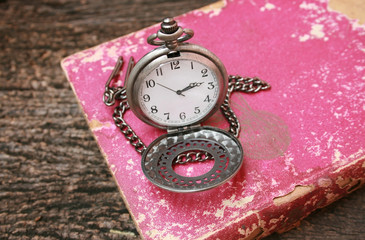 watch on old book