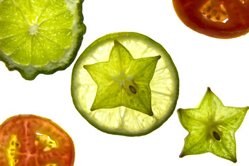 Slices of  fruit with Vegetables on white background.