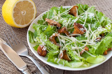 salad with mushrooms (chanterelles), parmesan, lettuce