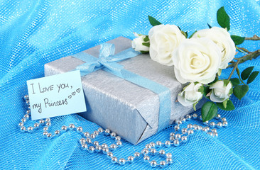 Romantic parcel on blue cloth background