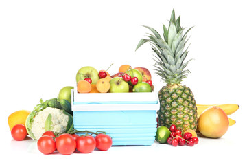 Fresh fruits and vegetables in mini refrigerator, isolated