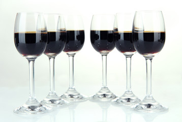 Glasses of liquor, isolated on white