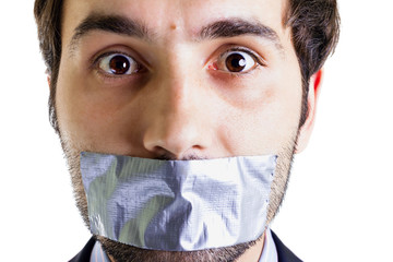 Scared businessman with duct tape on mouth