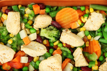 Mixed vegetables and chicken breast background
