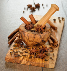 Wooden mortar with spices