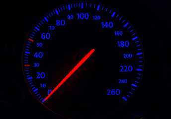 automobile tachometer on blue