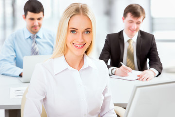 Fototapeta premium Cute businesswoman in an office