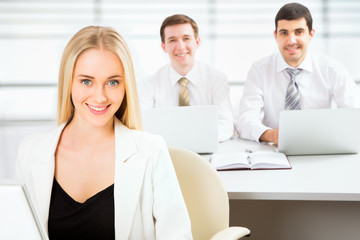 Fototapeta premium Cute businesswoman in an office