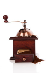 Coffee mill with coffee beans.