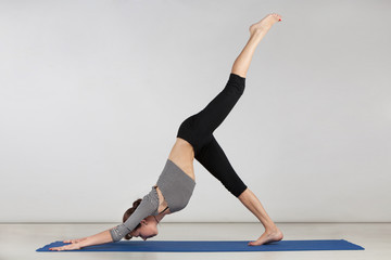 Young woman exercising yoga