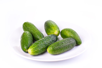 Cucumbers on a plate isolated on a white background