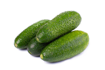Healthy food. The green cucumbers isolated on white background