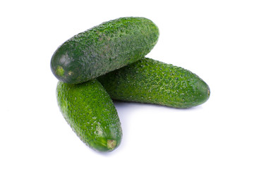 Healthy food. The green cucumbers isolated on white background