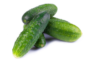Healthy food. The green cucumbers isolated on white background