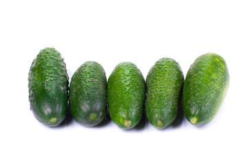 Healthy food. The green cucumbers isolated on white background