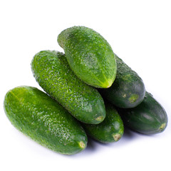 Healthy food. The green cucumbers isolated on white background