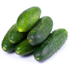 Healthy food. The green cucumbers isolated on white background