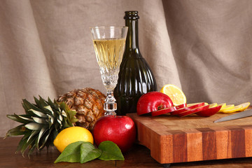 fruit and wine on a chopping board