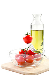 cherry tomatoes with a fork and olive oil