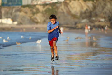 Boy playing on beach series